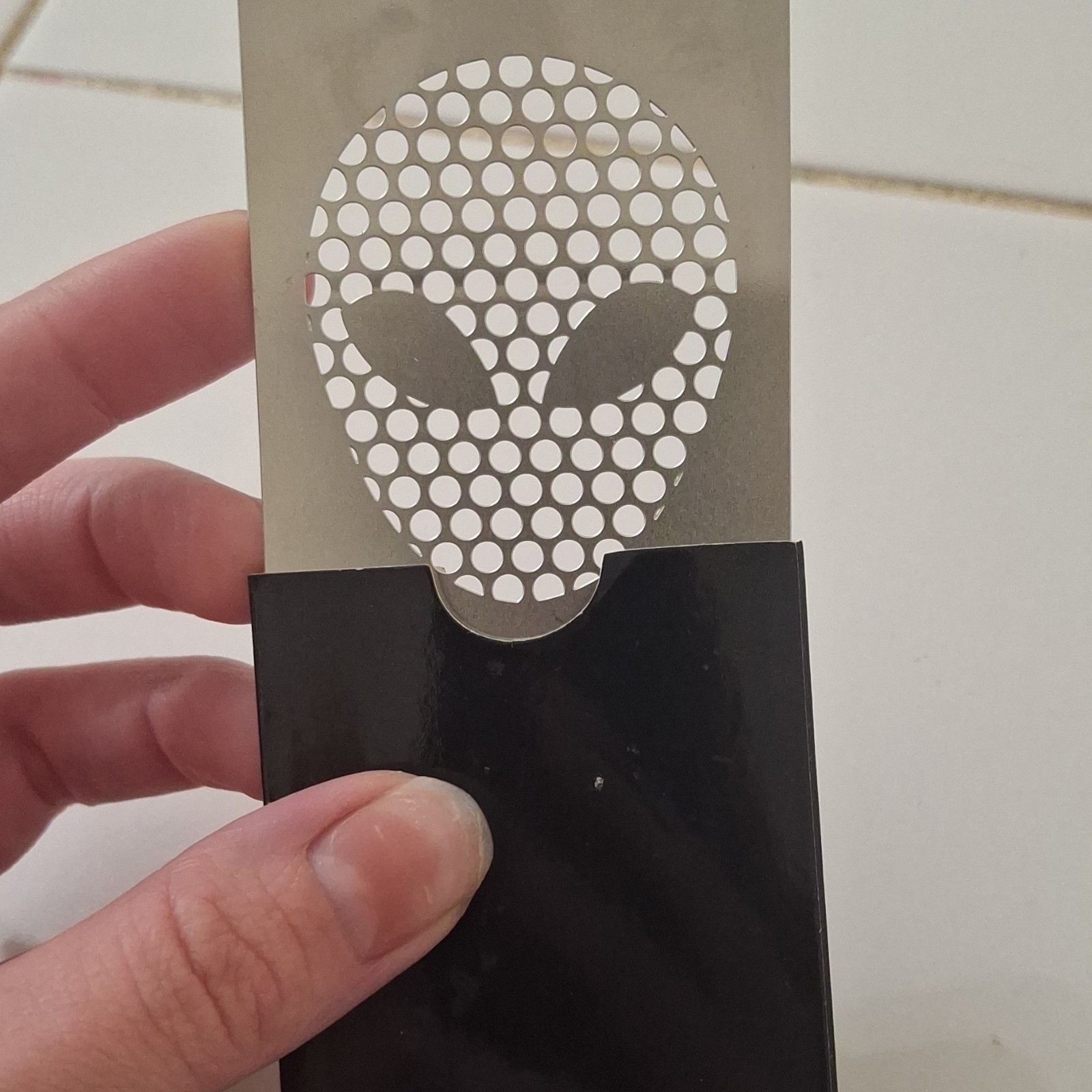 Alien Face Metal Scrapper to help roll the perfect joints
